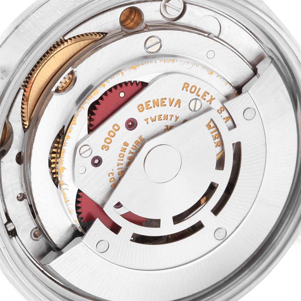 This image shows a close-up of the internal mechanical movement of a Rolex Air-King 14000 Men's Stainless Steel White Dial 14000 Men's Stainless Steel White Dial watch, highlighting gears and inscriptions.