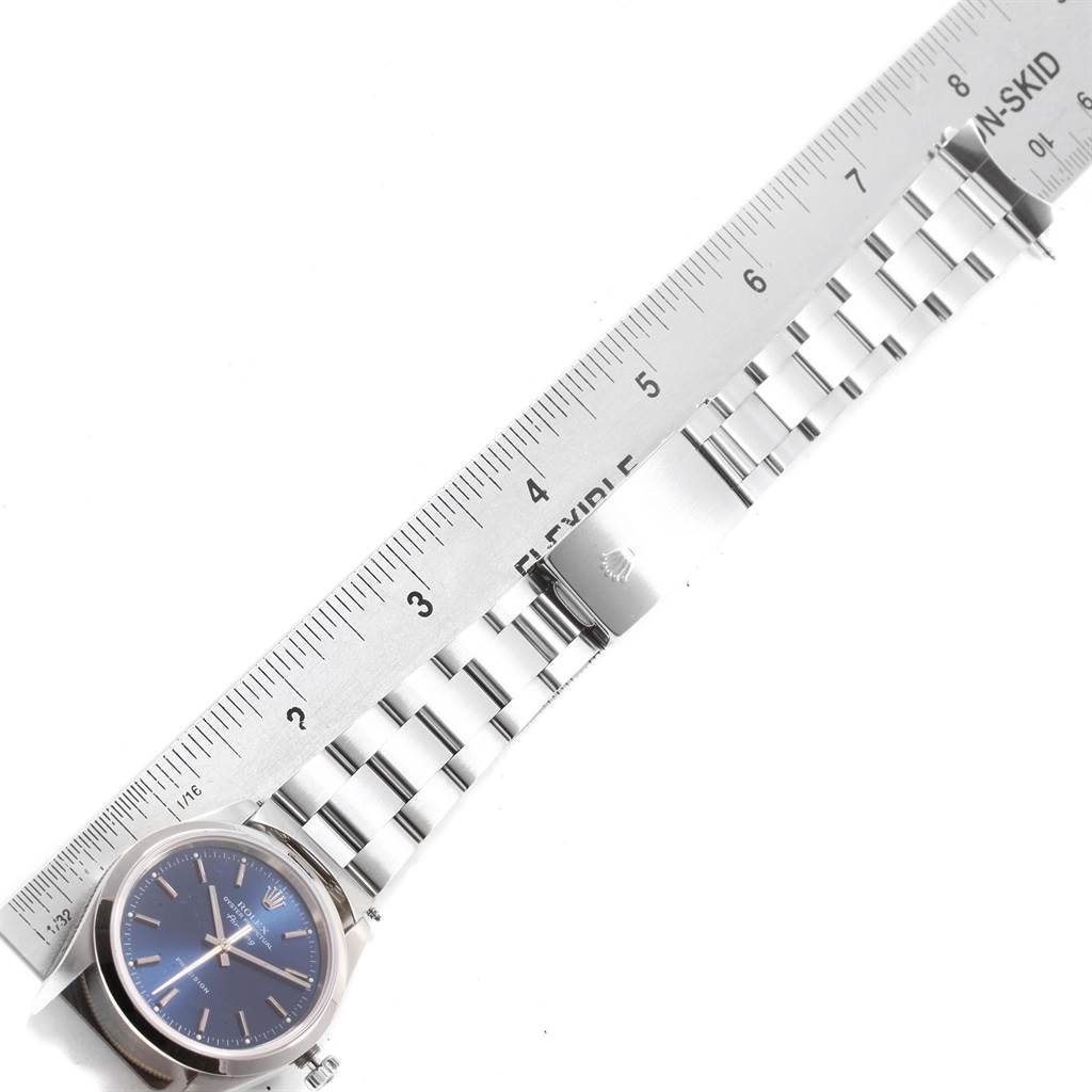 The image shows the Rolex Air-King 14000 Men's Stainless Steel Blue Dial 14000 Men's Stainless Steel Blue Dial watch laid flat, measured alongside a metal ruler, highlighting its bracelet and clasp.