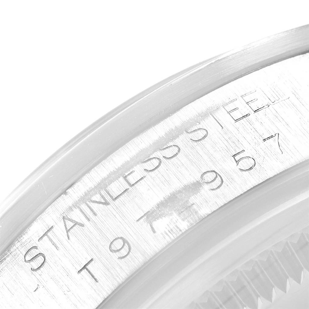 The image shows a close-up of the case back engraving on a Rolex Air-King 14000 Men's Stainless Steel Blue Dial 14000 Men's Stainless Steel Blue Dial watch, highlighting the "STAINLESS STEEL" and serial number.