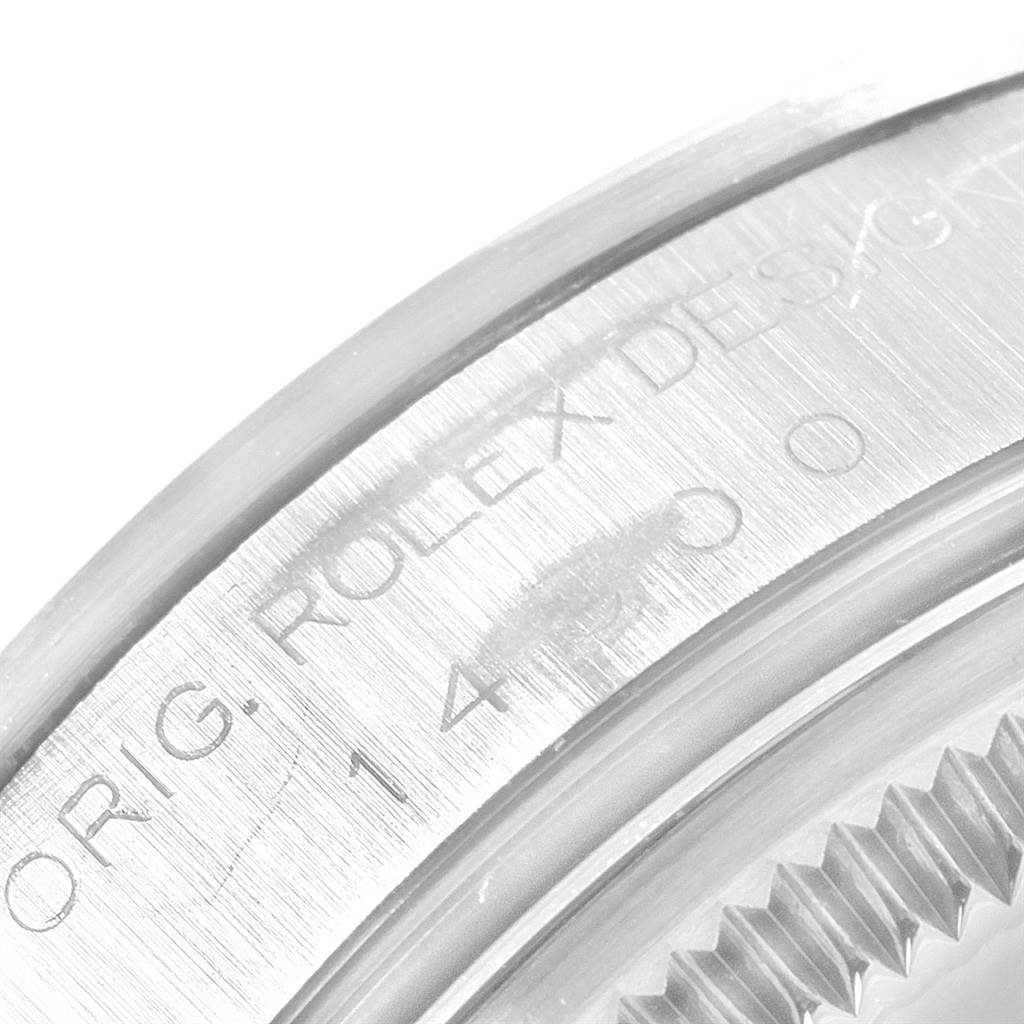 This close-up image shows the engraved bezel and case of a Rolex Air-King 14000 Men's Stainless Steel Blue Dial 14000 Men's Stainless Steel Blue Dial watch.