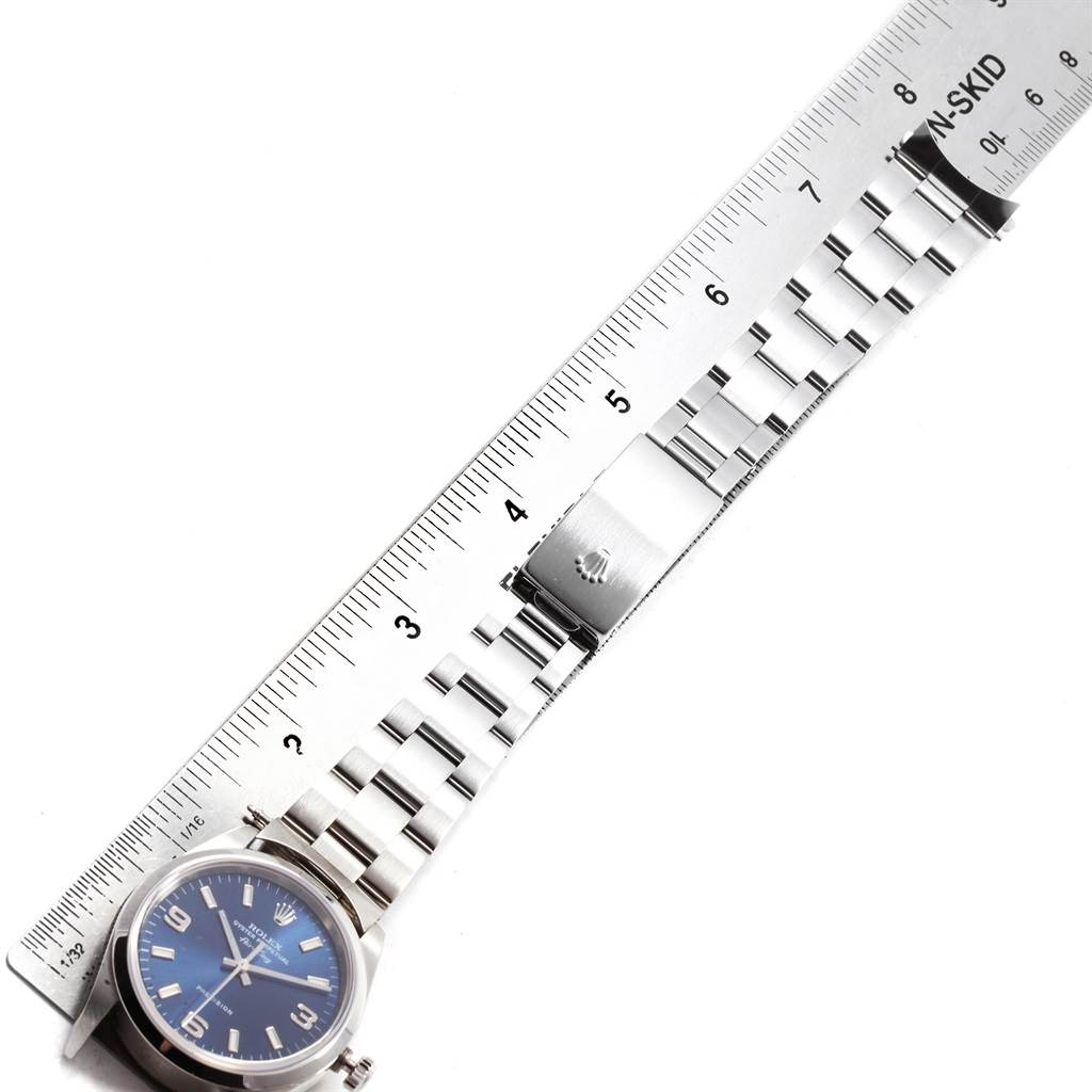 The image shows a Rolex Air-King 14000 Men's Stainless Steel Blue Dial 14000 Men's Stainless Steel Blue Dial watch laid flat with the case and bracelet visible alongside a ruler for scale.