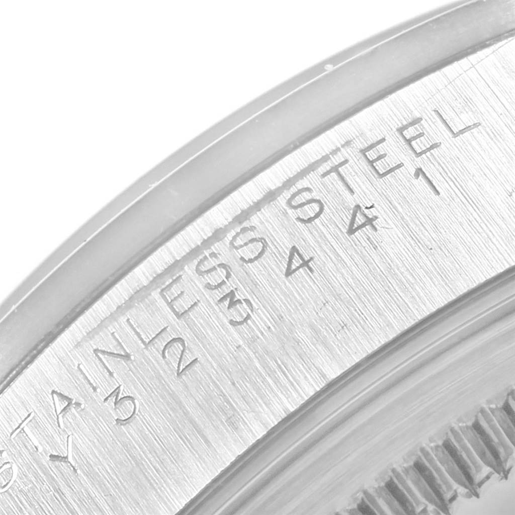 This is a close-up view of the stainless steel engraved bezel on a Rolex Air-King 14000 Men's Stainless Steel Blue Dial 14000 Men's Stainless Steel Blue Dial watch.