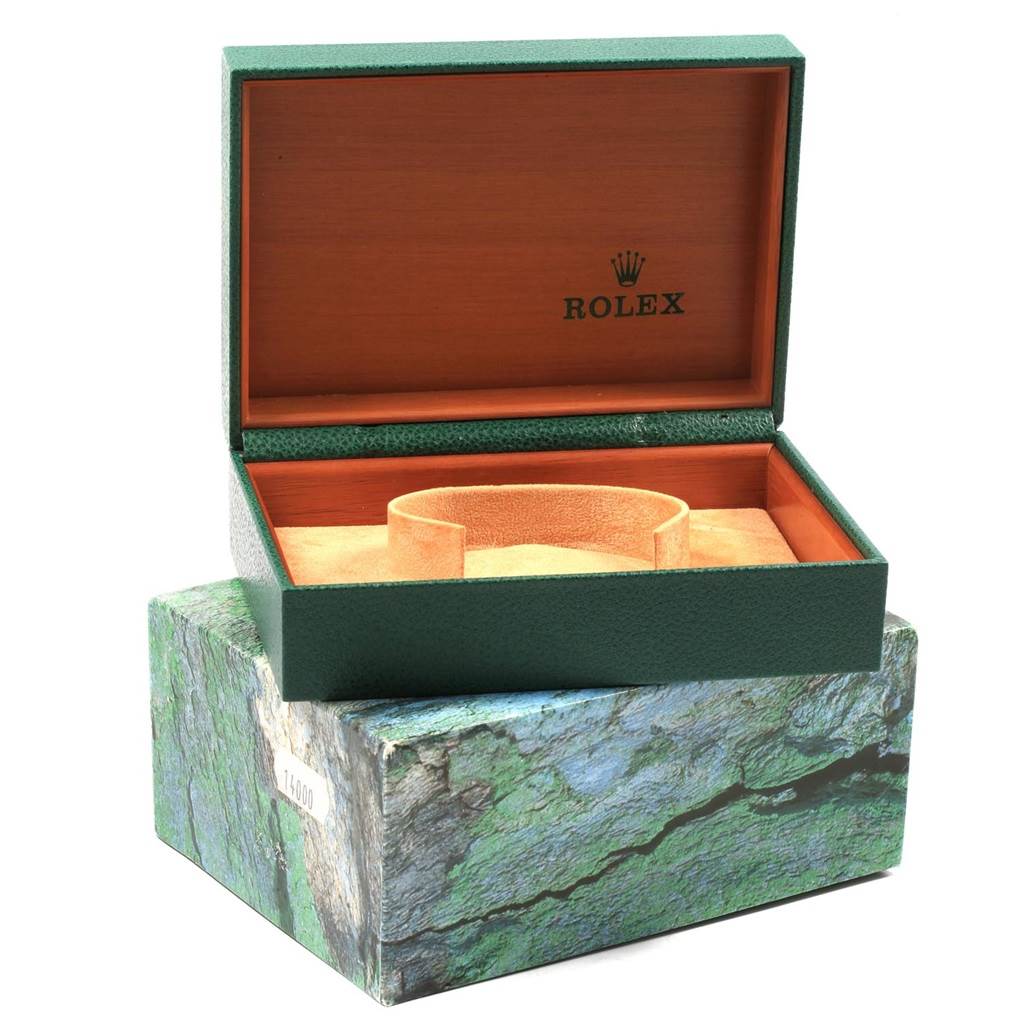 The image shows an opened green Rolex box for the Air-King model, displaying the interior cushioning without the watch.