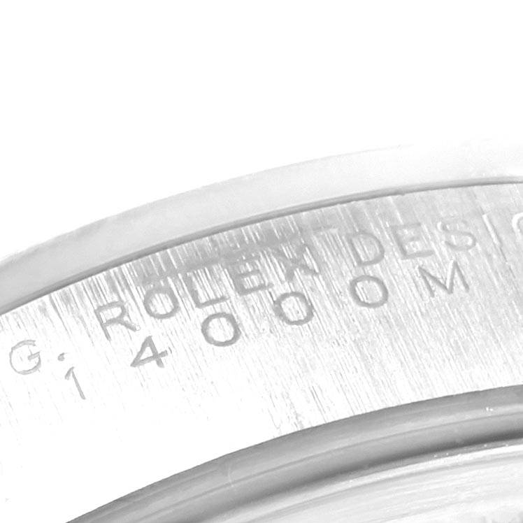 This close-up image shows the engraved side of the bezel on a Rolex Air-King 14000 Men's Stainless Steel Pink Dial 14000 Men's Stainless Steel Pink Dial watch.