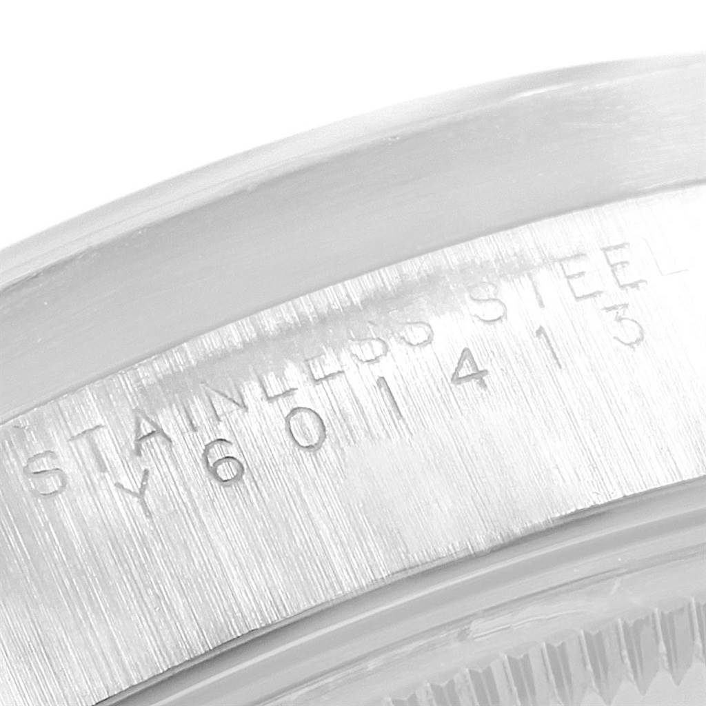 This image shows a close-up view of the stainless steel casing with engravings on a Rolex Air-King 14010 Men's Stainless Steel Silver Dial 14010 Men's Stainless Steel Silver Dial watch.