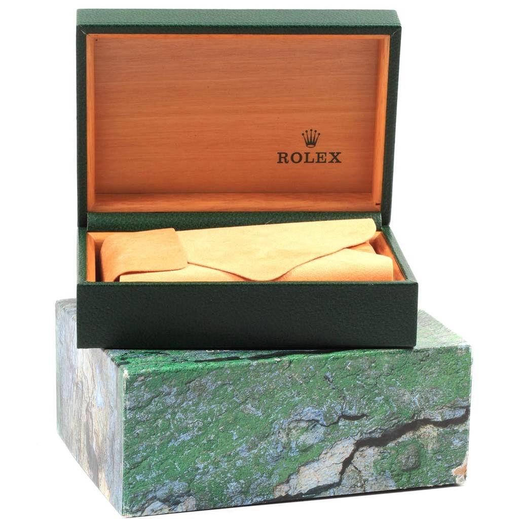 The image shows the packaging of a Rolex Air-King 14010 Men's Stainless Steel Silver Dial 14010 Men's Stainless Steel Silver Dial watch, including a green outer box, a wooden inner box, and a suede pouch.