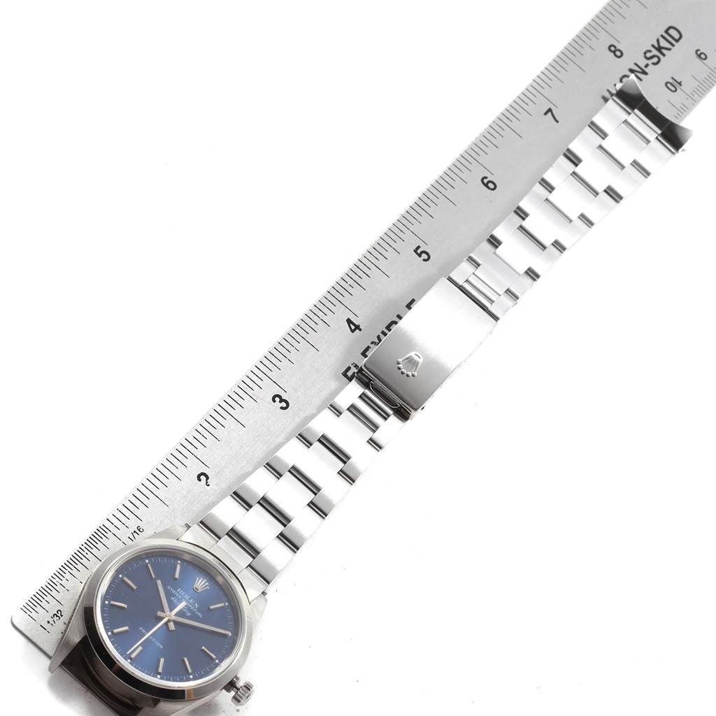 The image shows a Rolex Air-King 14000 Men's Stainless Steel Blue Dial 14000 Men's Stainless Steel Blue Dial watch from a top-down angle alongside a measuring ruler.