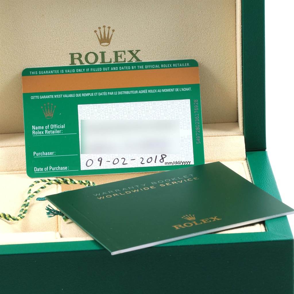 The image shows the warranty card and booklet for the Rolex Air-King 116900 Men's Stainless Steel Black Dial 116900 Men's Stainless Steel Black Dial model, placed inside a green Rolex box.