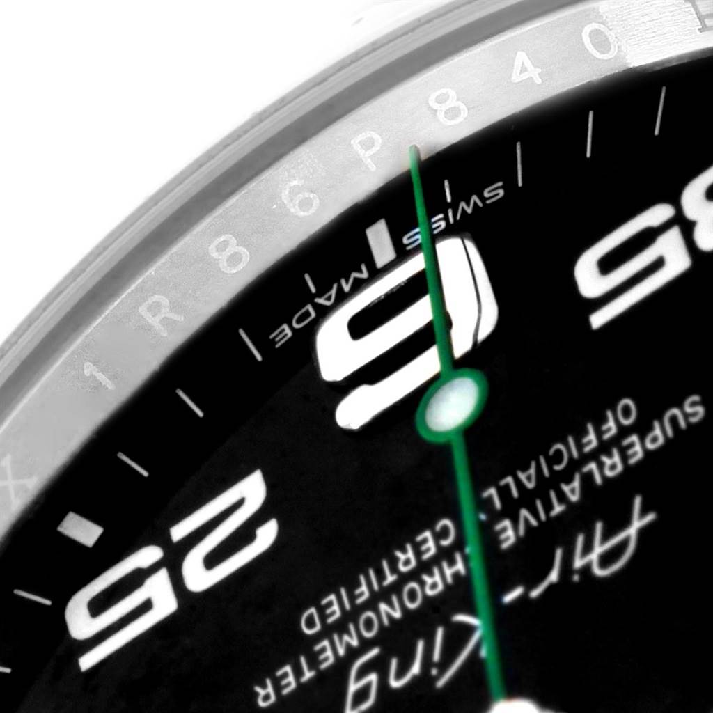 This image shows a close-up of the dial of a Rolex Air-King 116900 Men's Stainless Steel Black Dial 116900 Men's Stainless Steel Black Dial watch, highlighting the 9 and part of the 3-hour markers, the green seconds hand, and the "Swiss Made" text.