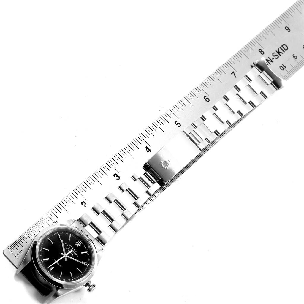The image shows a Rolex Air-King 14000 Men's Stainless Steel Black Dial 14000 Men's Stainless Steel Black Dial watch with its bracelet, laid on a ruler for measurement.