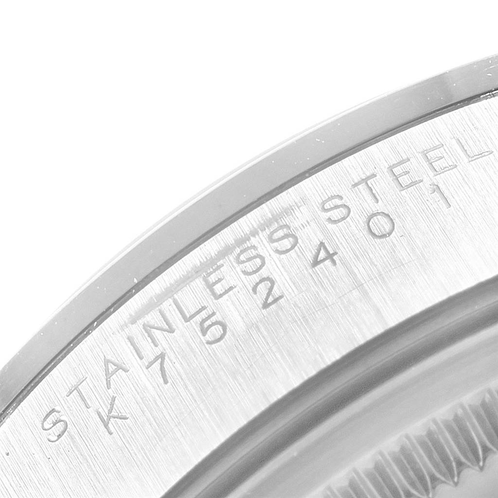 The image shows a close-up of the bezel and part of the case back of a Rolex Air-King 14000 Men's Stainless Steel Black Dial 14000 Men's Stainless Steel Black Dial watch, highlighting "STAINLESS STEEL" engraving.