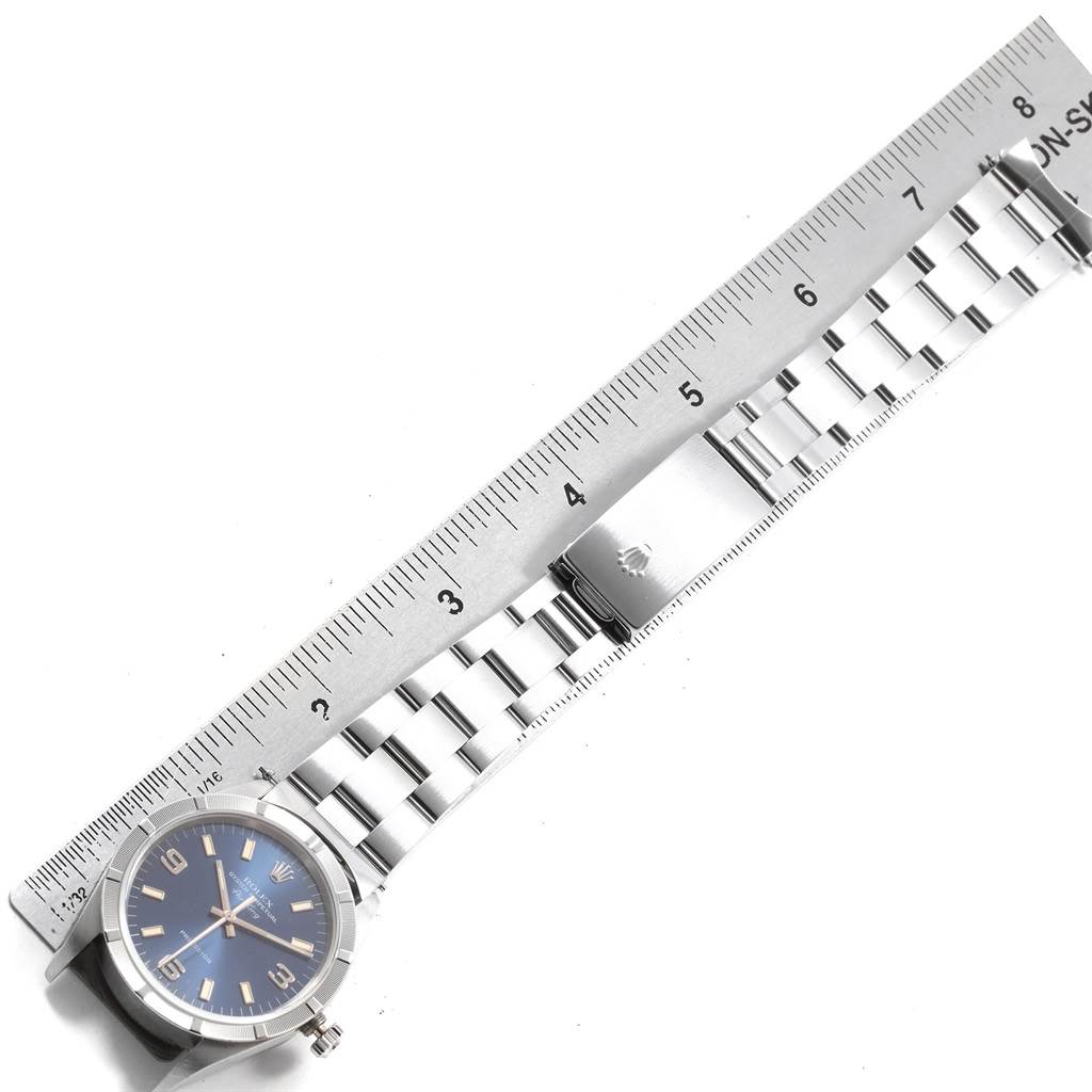 The image shows the Rolex Air-King 14010 Men's Stainless Steel Blue Dial 14010 Men's Stainless Steel Blue Dial watch face and part of the bracelet, alongside a ruler for scale.