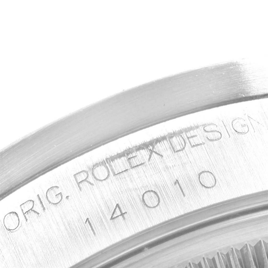 This close-up image shows the engraved case back of a Rolex Air-King 14010 Men's Stainless Steel Blue Dial 14010 Men's Stainless Steel Blue Dial watch, focusing on the "ORIG. ROLEX DESIGN" inscription and model number 14010.