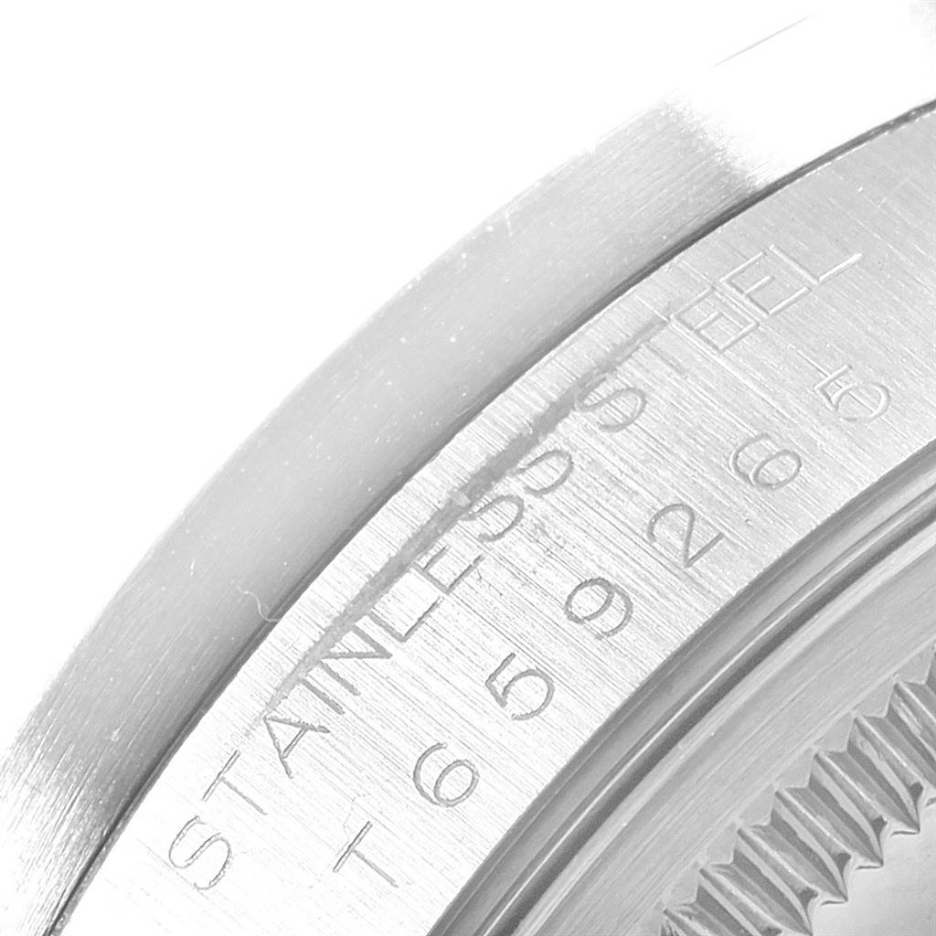 The image shows a close-up of the stainless steel case back with engravings of a Rolex Air-King 14010 Men's Stainless Steel Blue Dial 14010 Men's Stainless Steel Blue Dial watch.
