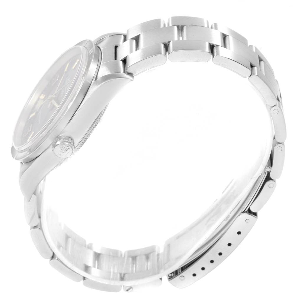 The image shows a side view of the Rolex Air-King 14010 Men's Stainless Steel Blue Dial 14010 Men's Stainless Steel Blue Dial watch, highlighting its bezel, crown, and bracelet.