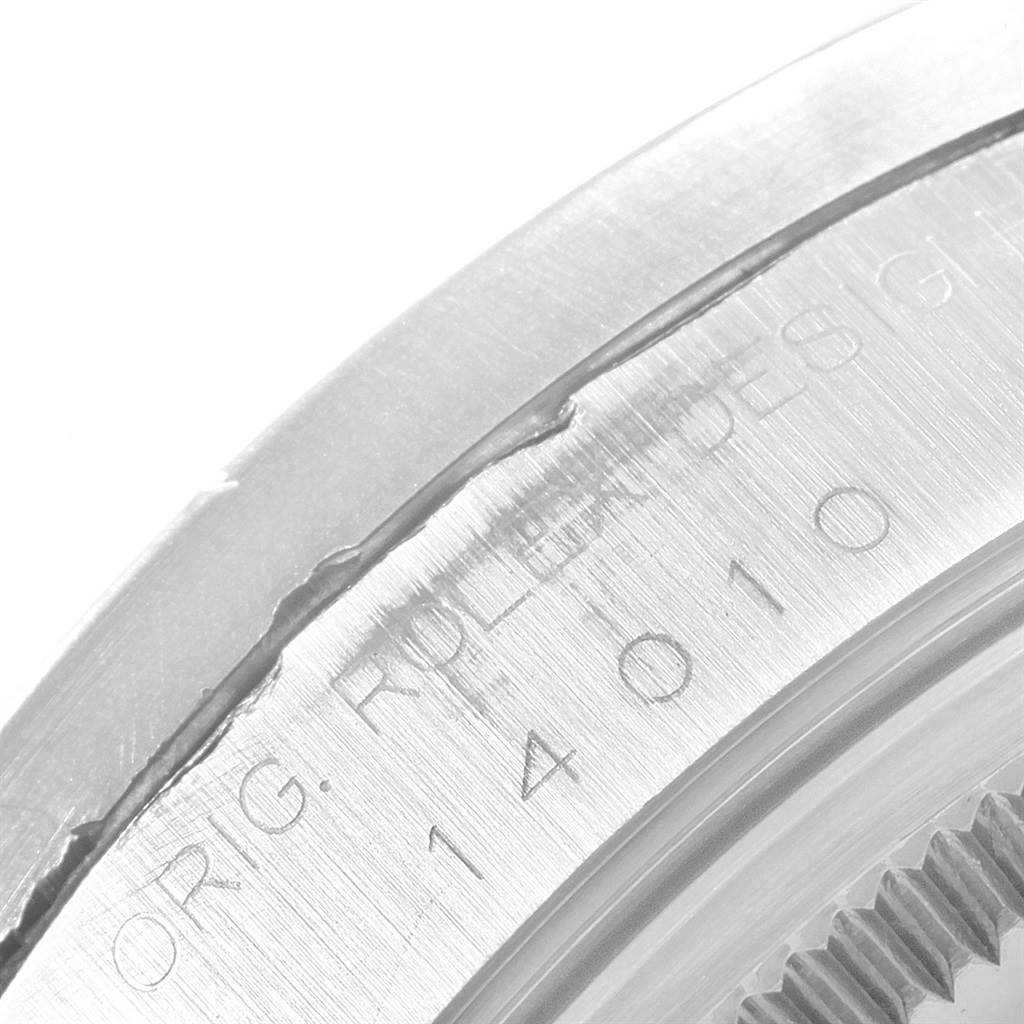 This close-up image shows the engraved case back of a Rolex Air-King 14010 Men's Stainless Steel Black Dial 14010 Men's Stainless Steel Black Dial watch, including the model number and branding.