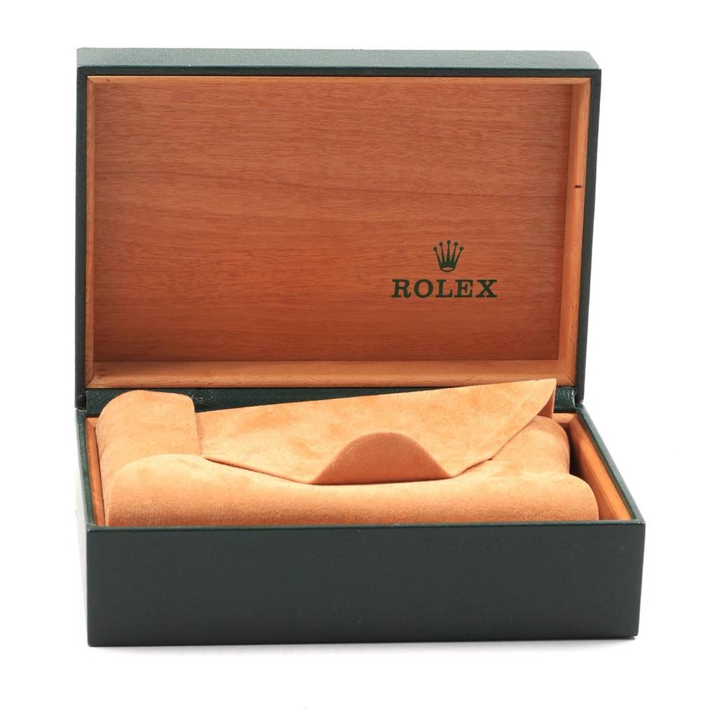 This image shows an open Rolex Air-King 14010 Men's Stainless Steel Black Dial 14010 Men's Stainless Steel Black Dial watch box with a tan interior and cushion, displaying the brand's logo inside the lid.