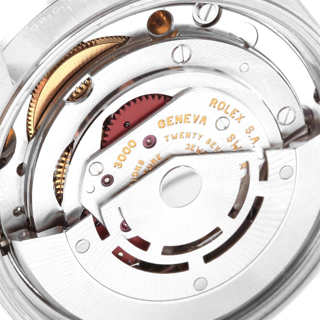 This image shows a close-up of the internal mechanism of the Rolex Air-King 14000 Men's Stainless Steel White Dial 14000 Men's Stainless Steel White Dial watch, highlighting its intricate gears and components.