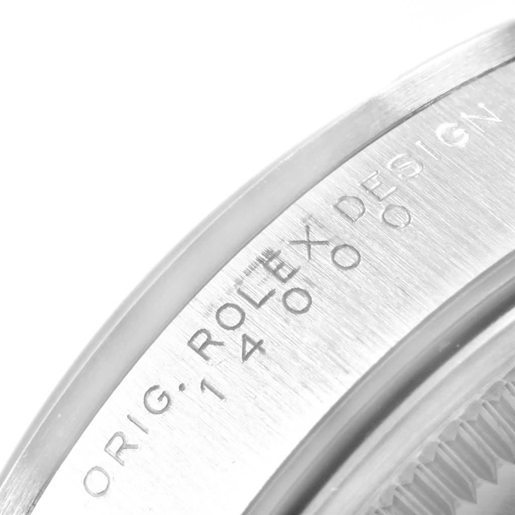 This image shows a close-up of the edge of the casing of a Rolex Air-King 14000 Men's Stainless Steel White Dial 14000 Men's Stainless Steel White Dial watch, highlighting the engraved text.