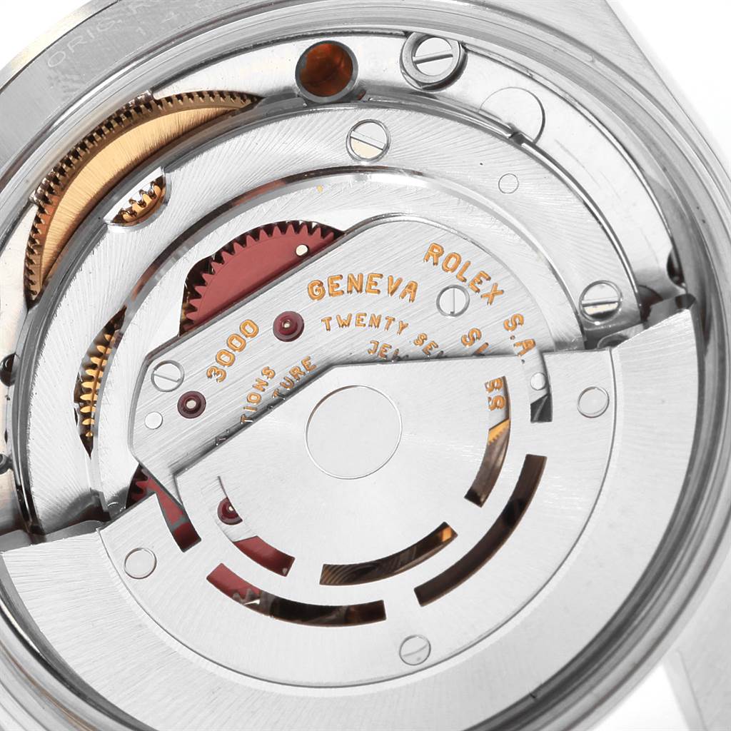 The image shows a close-up of the internal mechanical movement of a Rolex Air-King 14000 Men's Stainless Steel Blue Dial 14000 Men's Stainless Steel Blue Dial watch, highlighting gears and inscriptions.