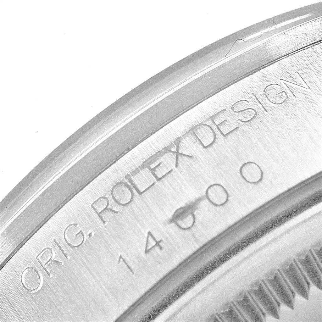 The image shows a close-up of the engraved case back of a Rolex Air-King 14000 Men's Stainless Steel Blue Dial 14000 Men's Stainless Steel Blue Dial watch, highlighting "ORIG. ROLEX DESIGN" and the model number.