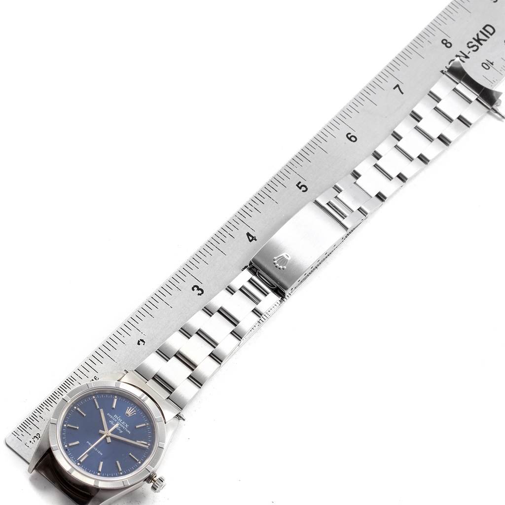 The image shows a Rolex Air-King 14010 Men's Stainless Steel Blue Dial 14010 Men's Stainless Steel Blue Dial watch laid flat, highlighting its stainless steel bracelet and clasp, with a ruler for scale.