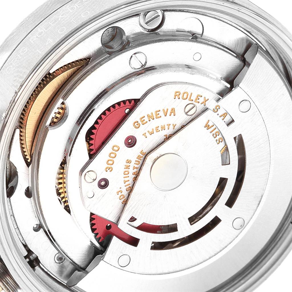 This image shows a close-up view of the intricate internal mechanism of a Rolex Air-King 14010 Men's Stainless Steel Blue Dial 14010 Men's Stainless Steel Blue Dial watch, highlighting gears and engravings.