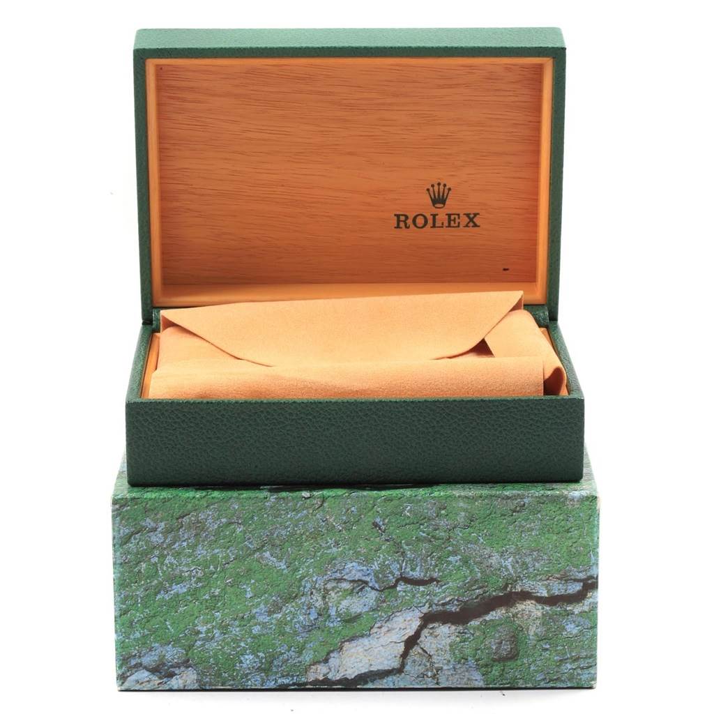 This image shows an open Rolex box, likely for the Air-King model, with the watch not visible and wrapped inside.