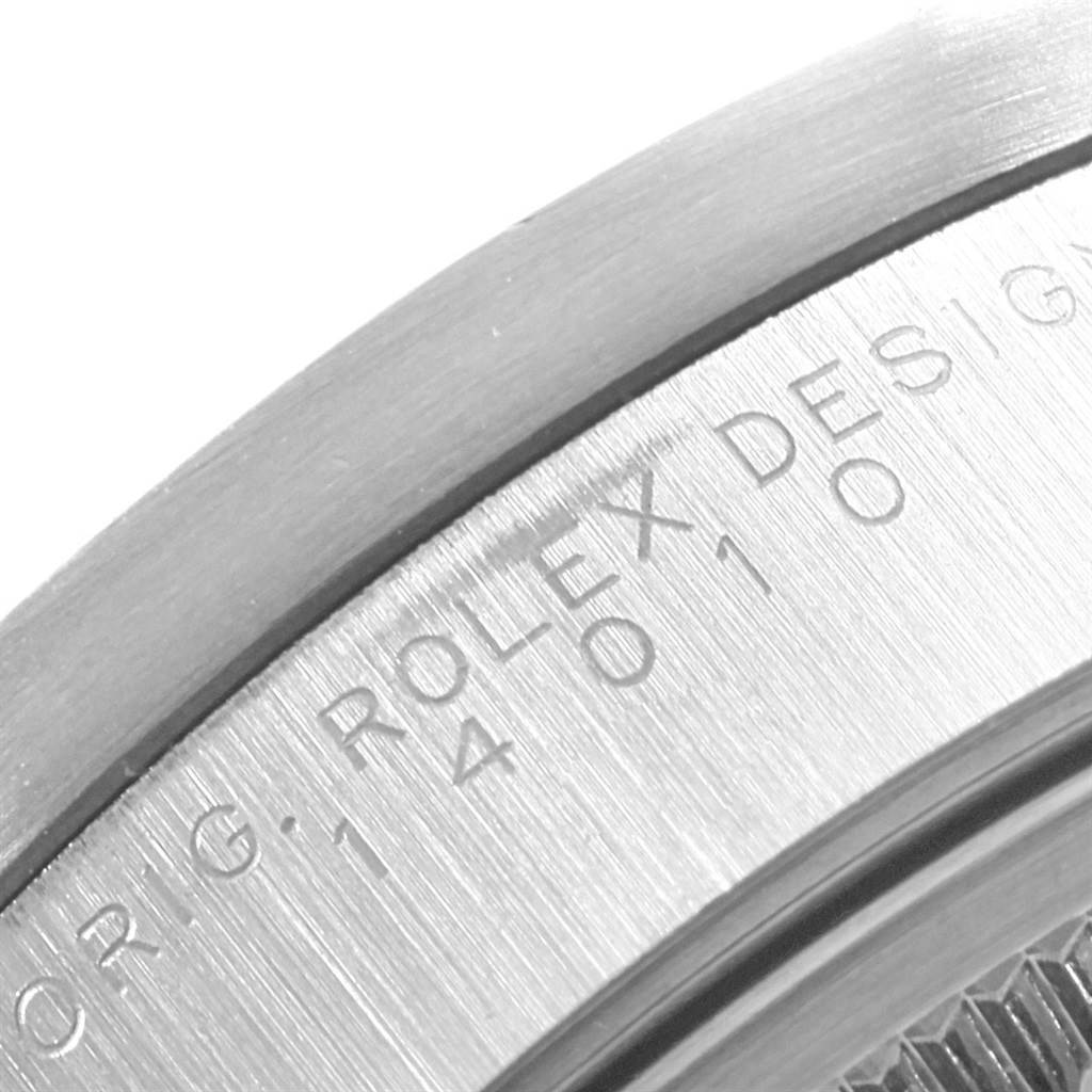 This close-up image shows the engraved text on the outer rim of the Rolex Air-King 14010 Men's Stainless Steel Black Dial 14010 Men's Stainless Steel Black Dial watch.