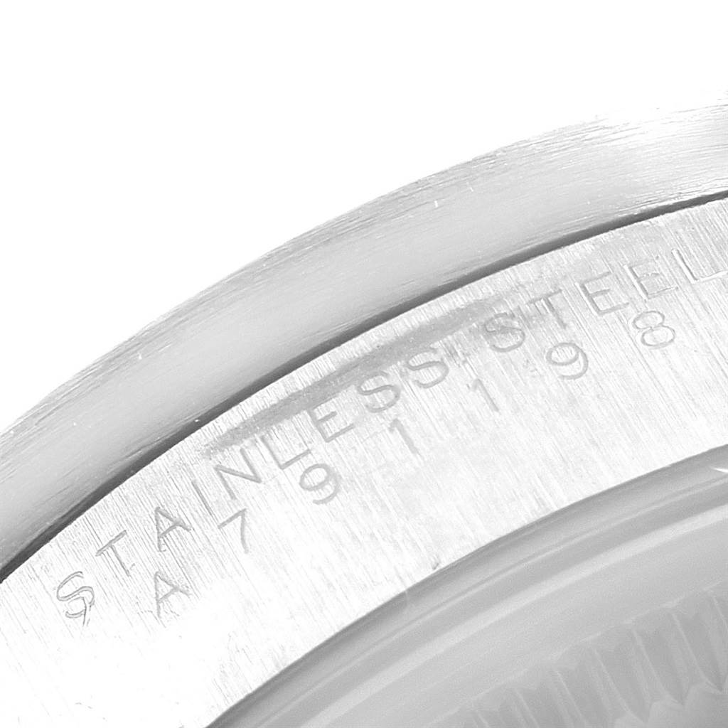 The image shows a close-up of the edge of the case back with "STAINLESS STEEL" inscription for the Rolex Air-King 14010 Men's Stainless Steel Black Dial 14010 Men's Stainless Steel Black Dial watch model.
