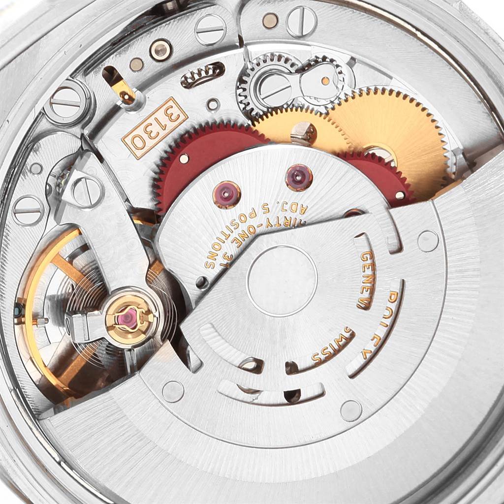 This image shows the intricate internal movement mechanism of a Rolex Air-King 114234 Men's Stainless Steel Blue Dial 114234 Men's Stainless Steel Blue Dial watch, visible from a rear angle.