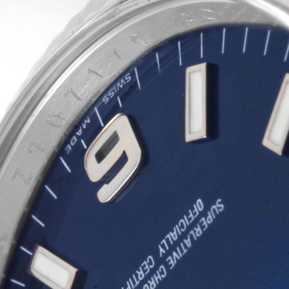 The image shows a close-up of the dial and bezel of a Rolex Air-King 114234 Men's Stainless Steel Blue Dial 114234 Men's Stainless Steel Blue Dial watch, focusing on the numeral 9 and surrounding markers.