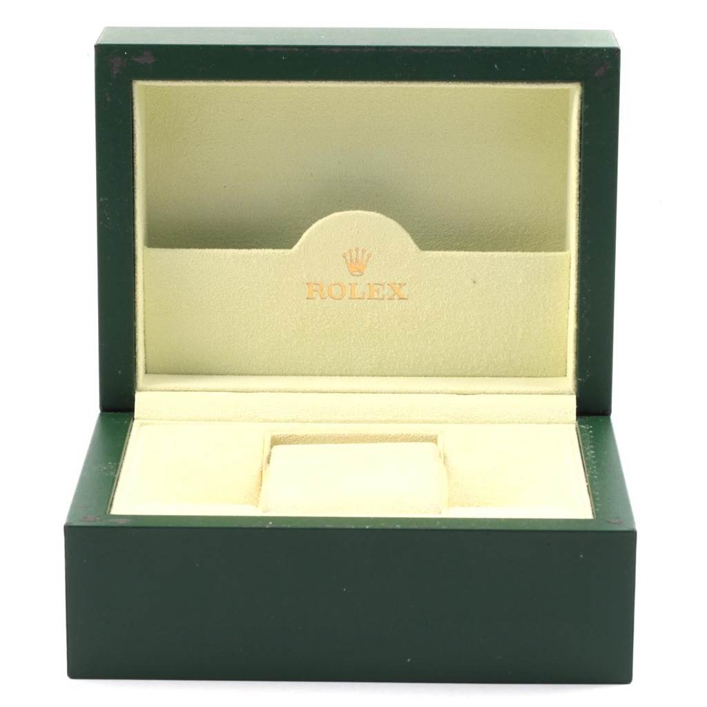 The image shows the open box of a Rolex Air-King 20465 Men's Stainless Steel Silver Dial 20465 Men's Stainless Steel Silver Dial watch, revealing its green exterior and beige interior.