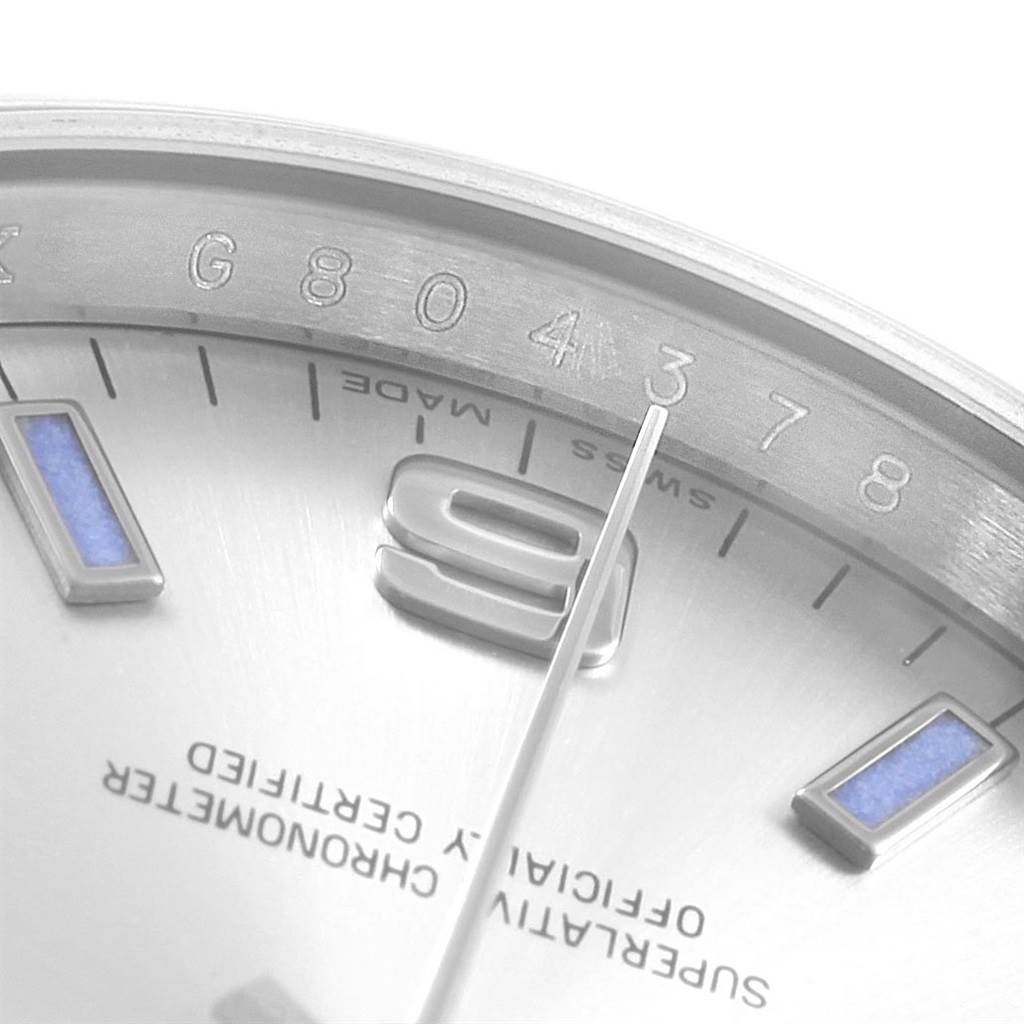 This close-up image shows the dial and part of the bezel of the Rolex Air-King 114200 Men's Stainless Steel Silver Dial 114200 Men's Stainless Steel Silver Dial watch, highlighting the hour markers and second hand.