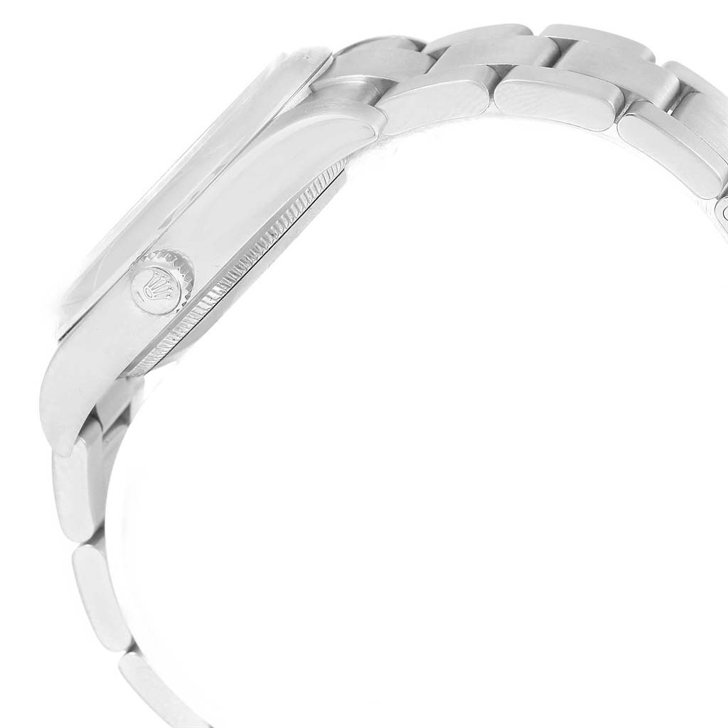 This side-angle view of the Rolex Air-King 114200 Stainless Steel White Dial 114200 Stainless Steel White Dial watch showcases its case, crown, and bracelet.