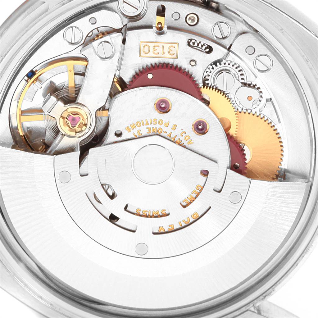 The image shows a close-up view of the internal mechanism of a Rolex Air-King 114200 Men's Stainless Steel White Dial 114200 Men's Stainless Steel White Dial watch, highlighting gears and movement components.