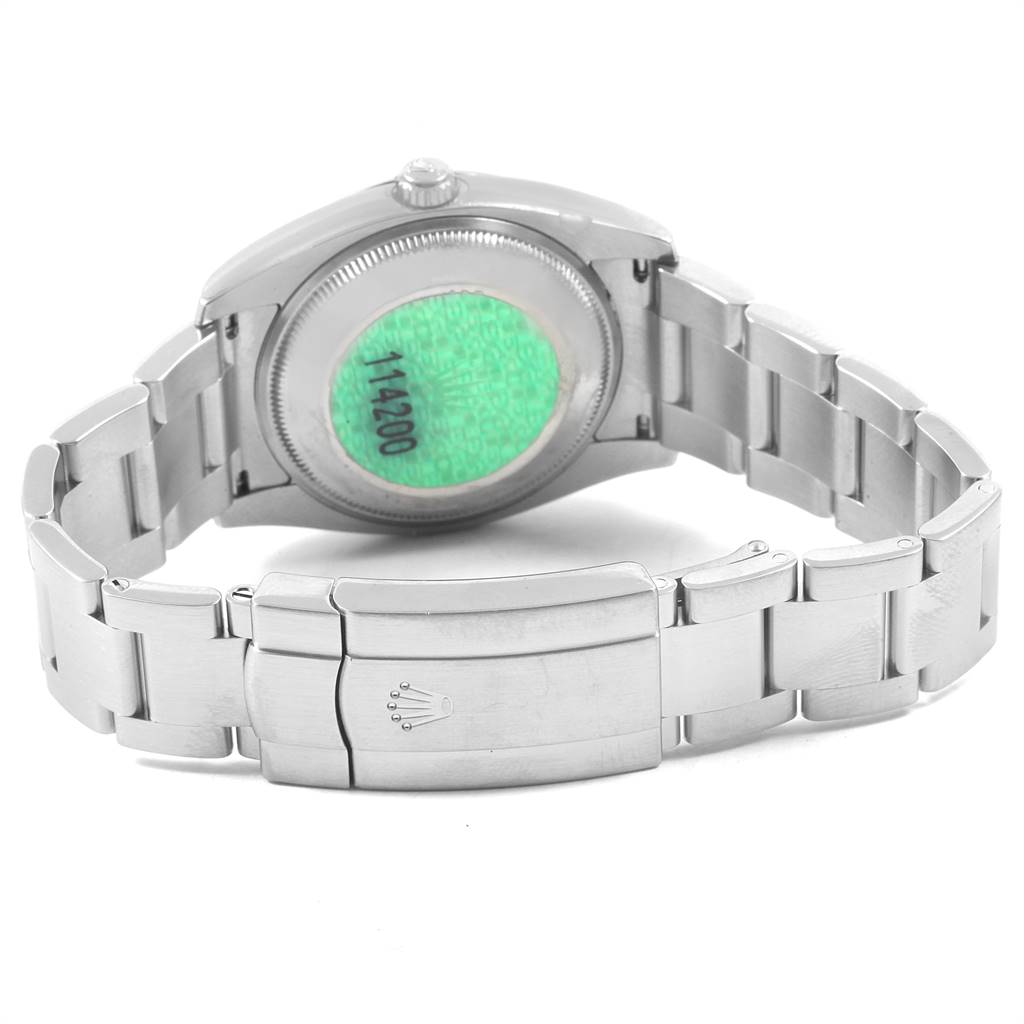 The image shows the back view of a Rolex Air-King 114200 Men's Stainless Steel White Dial 114200 Men's Stainless Steel White Dial watch, highlighting its stainless steel bracelet and clasp.