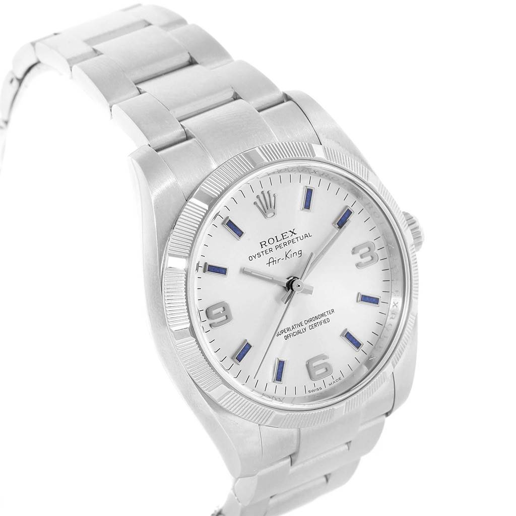 The Rolex Air-King 114210 Men's Stainless Steel Silver Dial 114210 Men's Stainless Steel Silver Dial watch is shown at an angle highlighting the face, bezel, crown, and part of the bracelet.