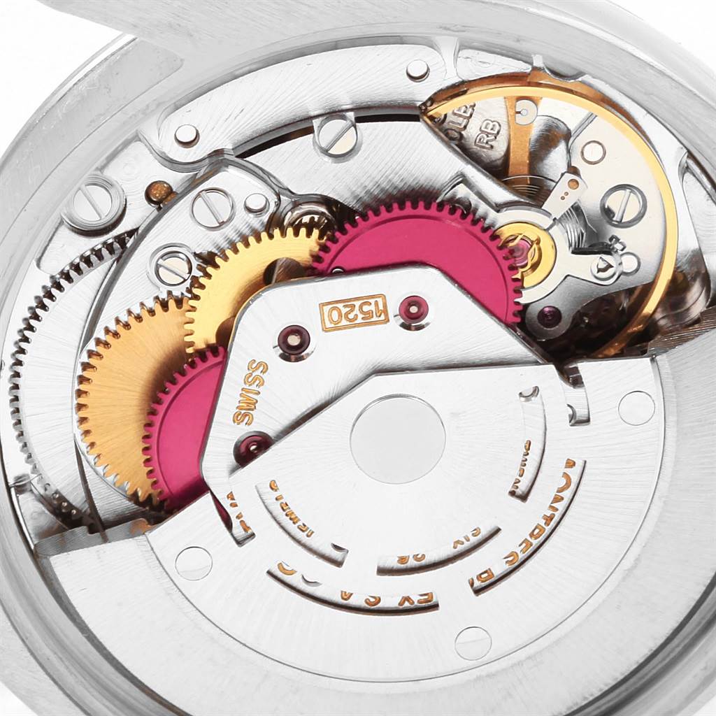 This close-up image shows the intricate inner mechanics of a Rolex Air-King 5500 Men's Stainless Steel Silver Dial 5500 Men's Stainless Steel Silver Dial watch, highlighting its gears and movement parts.