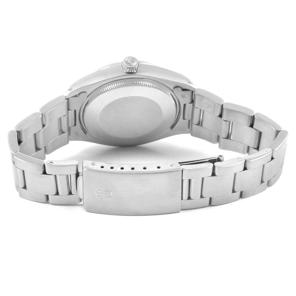 The image shows the back of the Rolex Air-King 5500 Men's Stainless Steel Silver Dial 5500 Men's Stainless Steel Silver Dial watch, featuring the case back and the clasp of the metal bracelet.