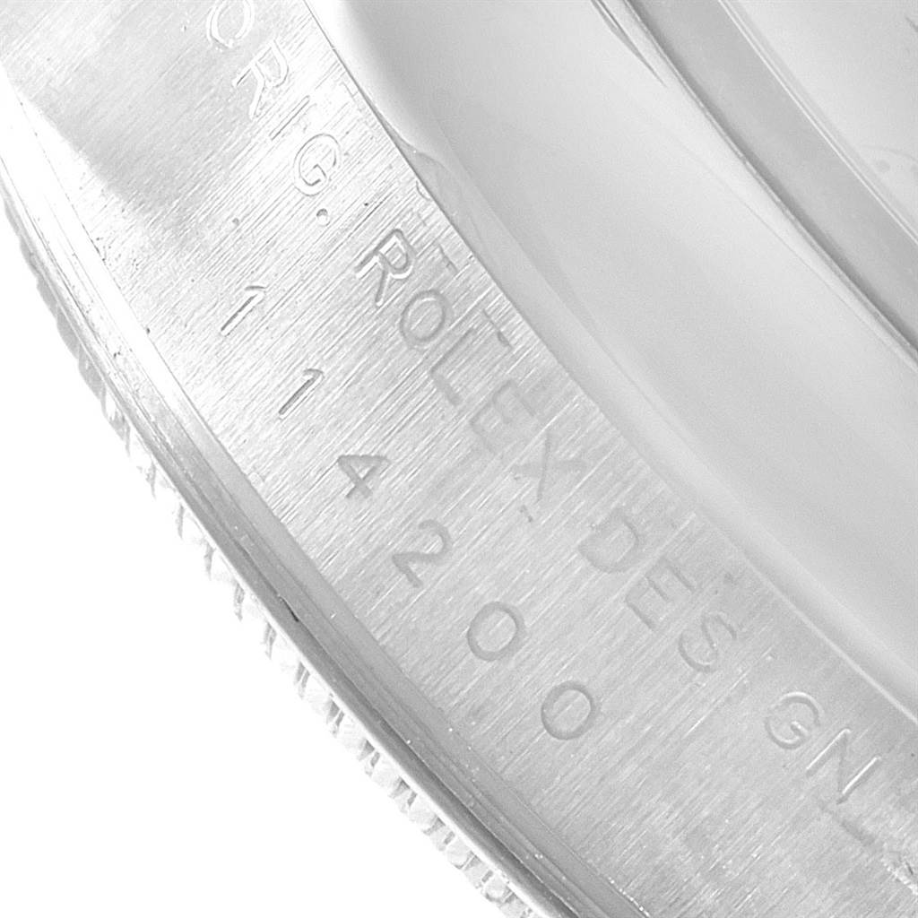 This image shows a close-up of the engraved bezel on the Rolex Air-King 114200 Men's Stainless Steel Silver Dial 114200 Men's Stainless Steel Silver Dial watch.