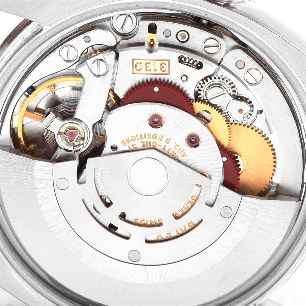 This image shows the intricate inner workings of a Rolex Air-King 114200 Men's Stainless Steel Silver Dial 114200 Men's Stainless Steel Silver Dial watch movement from a close-up, top-down angle.