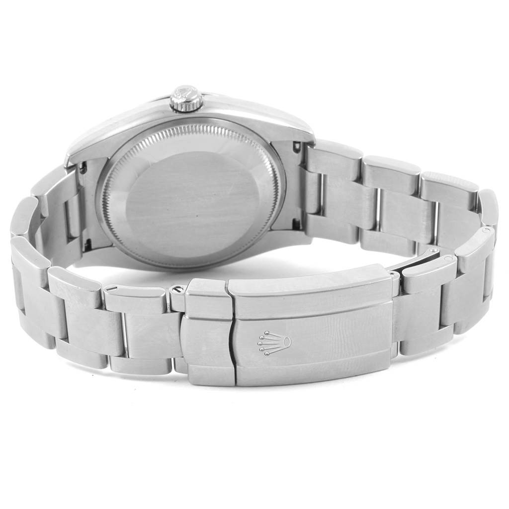 The image shows the back case, crown, and bracelet clasp of a Rolex Air-King 114200 Men's Stainless Steel Blue Dial 114200 Men's Stainless Steel Blue Dial watch.