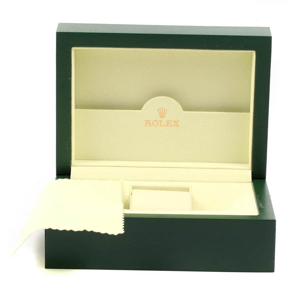 This is the packaging box for a Rolex Air-King 114200 Men's Stainless Steel Blue Dial 114200 Men's Stainless Steel Blue Dial watch, shown from the front with an opened lid and an included cleaning cloth.