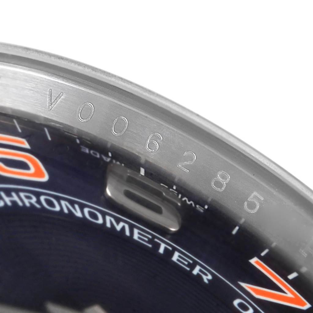 The image shows a close-up of the serial number and part of the dial of the Rolex Air-King 114200 Men's Stainless Steel Blue Dial 114200 Men's Stainless Steel Blue Dial watch.