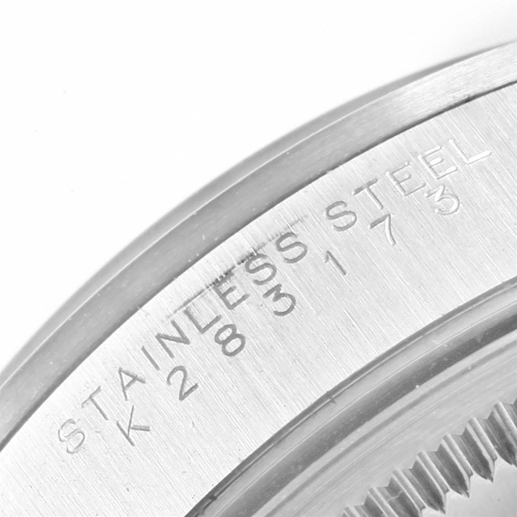 This close-up image shows the case back of a Rolex Air-King 14000 Men's Stainless Steel Blue Dial 14000 Men's Stainless Steel Blue Dial watch with the "STAINLESS STEEL" engraving.