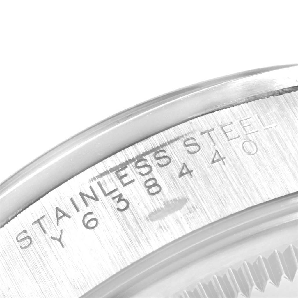 This image shows a close-up angle of the bezel and case back of a Rolex Air-King 14000 Men's Stainless Steel Silver Dial 14000 Men's Stainless Steel Silver Dial watch, highlighting the stainless steel engraving.