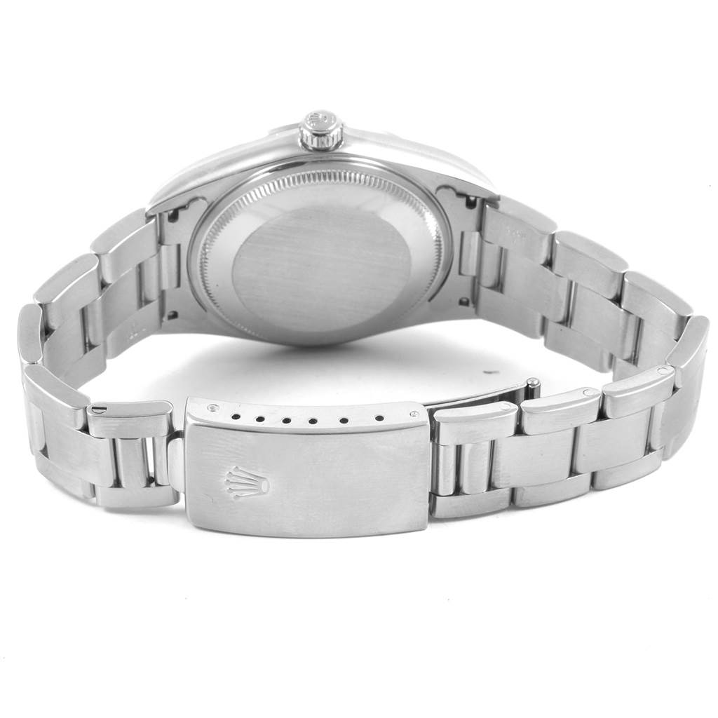 The image shows the back view of a Rolex Air-King 14000 Men's Stainless Steel Silver Dial 14000 Men's Stainless Steel Silver Dial watch, highlighting the case back and partially opened metal bracelet with clasp.