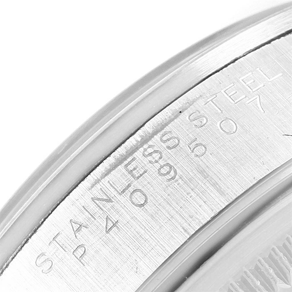 This image shows a close-up of the case back of a Rolex Air-King 14000 Men's Stainless Steel Blue Dial 14000 Men's Stainless Steel Blue Dial watch, emphasizing the "STAINLESS STEEL" engraving.