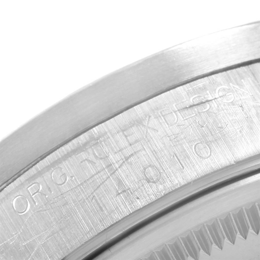 Close-up angle of the side, showing the engraved bezel and part of the case of a Rolex Air-King 14010 Men's Stainless Steel Silver Dial 14010 Men's Stainless Steel Silver Dial watch.